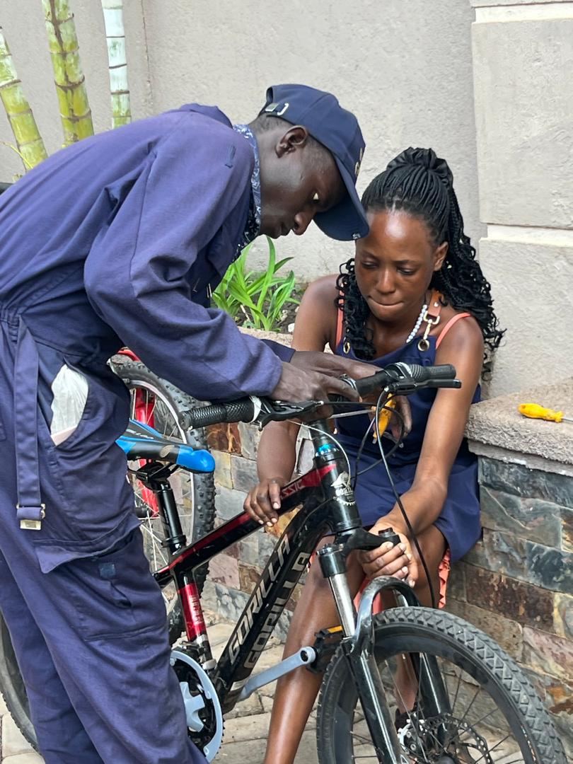 Mechanic fitting a wheel for a customer